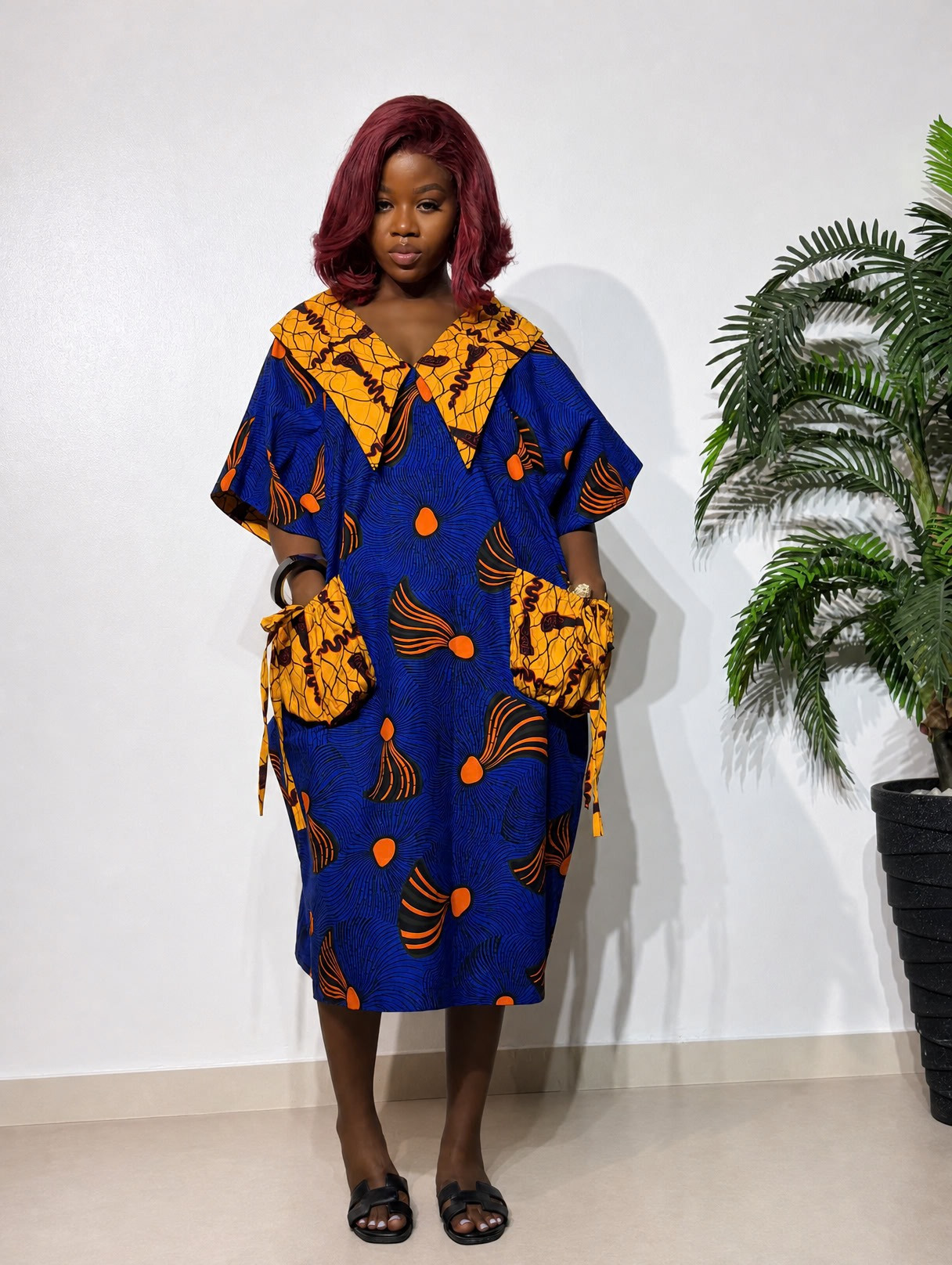 Adanma Ankara boubou for women, featuring a stylish three-quarter-length design, vibrant African print fabric, and a relaxed fit for elegant everyday wear.