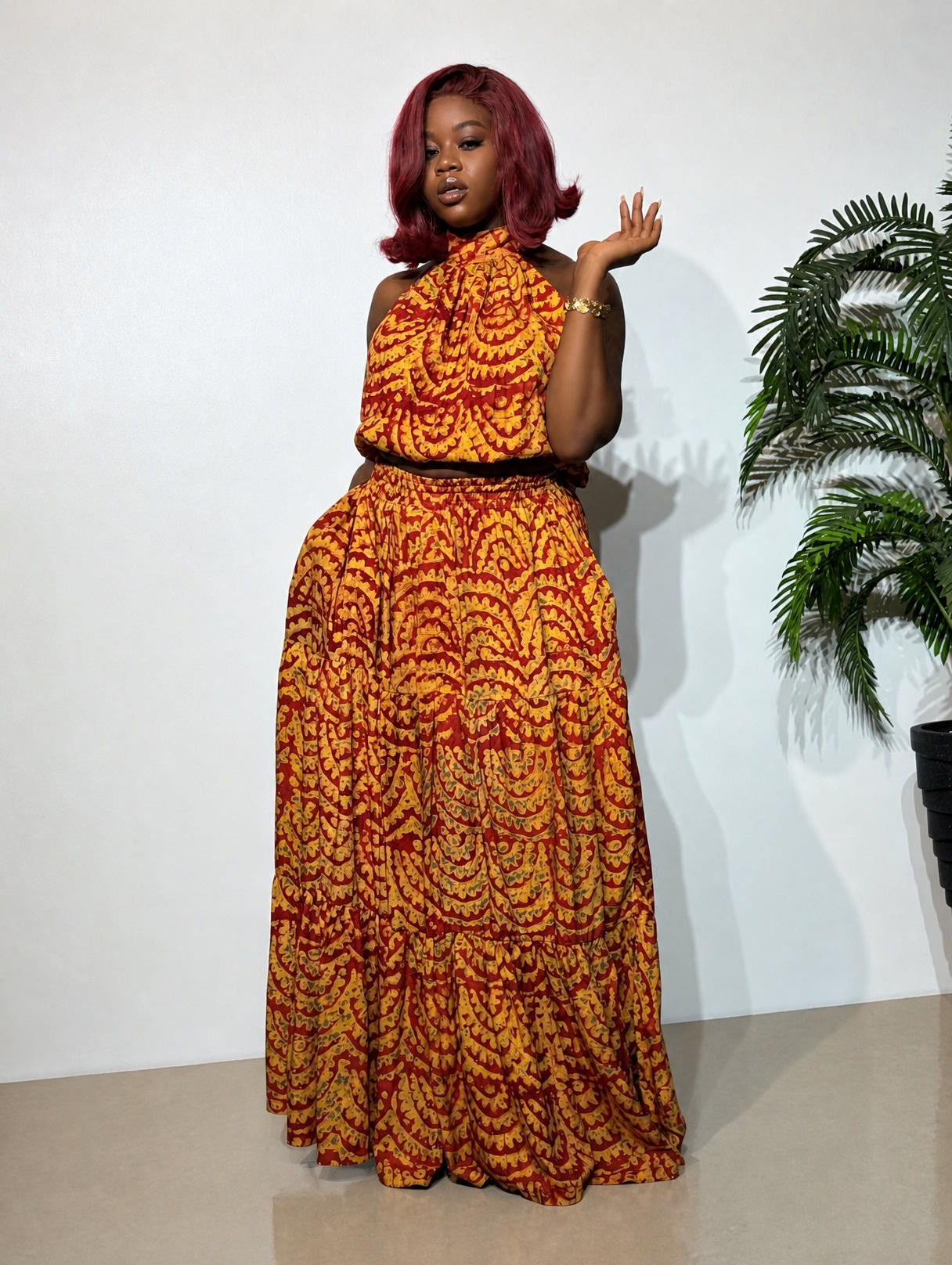 Adire two-piece outfit featuring a stylish matching top and flowing skirt, showcasing elegant African-inspired fashion and graceful movement.